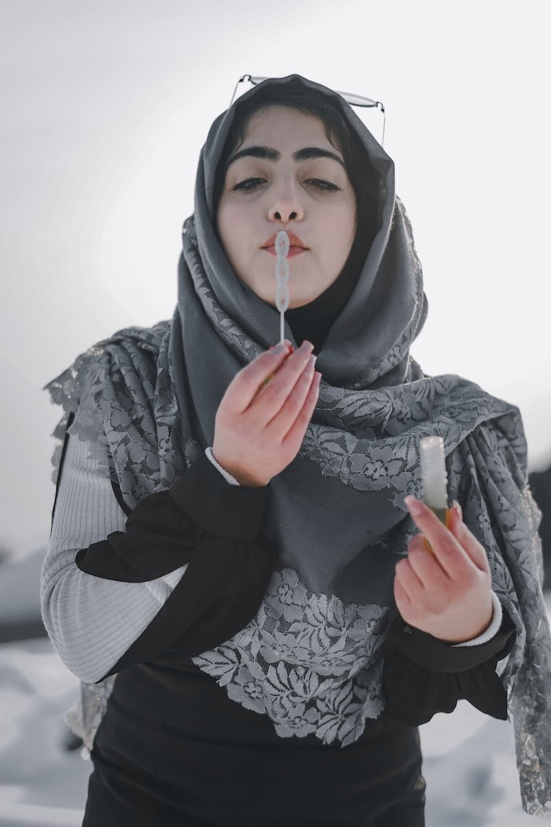 woman in black and white hijab